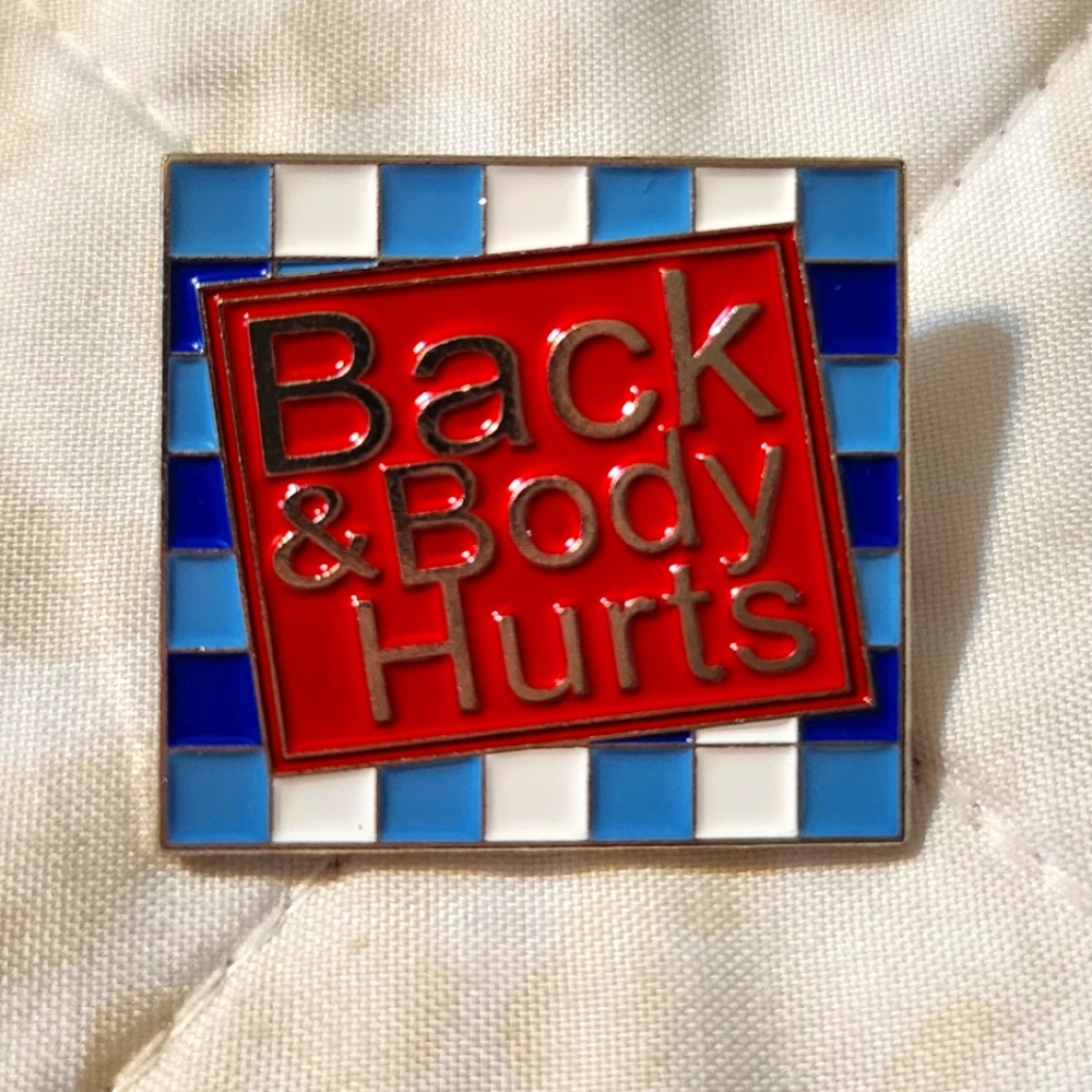 Enamel/ metal pin.